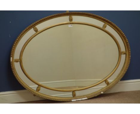Late 19th/early 20th century oval giltwood and gesso mirror, 123cm x 88cm