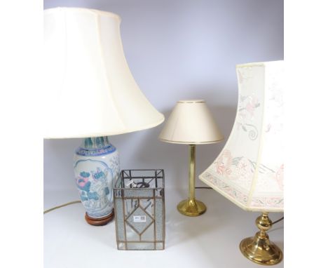 Oriental style pottery table lamp, two gilt metal table lamps and leaded glass shade (4)   Condition Report   Click here for 