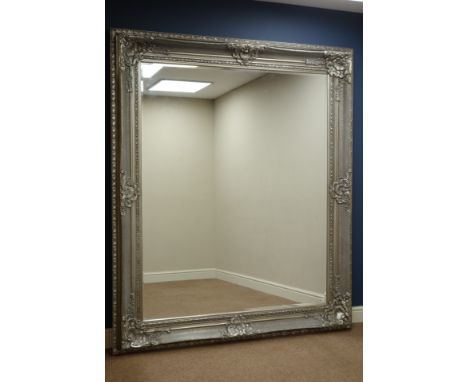 Large rectangular bevelled edge wall mirror in ornate swept silvered frame, 170cm x 200cm