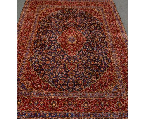 Large Persian Kashan red and blue ground rug carpet, trailing floral overall design, central medallion, 376cm x 288cm   Condi