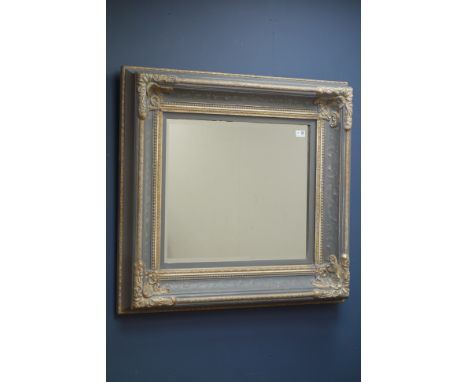 Rectangular bevel edged wall mirror in parcel gilt swept frame, 92cm x 83cm   Condition Report   Click here for further image