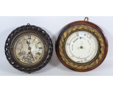 Ship's bulk head clock, white Roman dial with subsidiary seconds in rope twist carved oak frame, D24cm and a Ship's Aneroid b