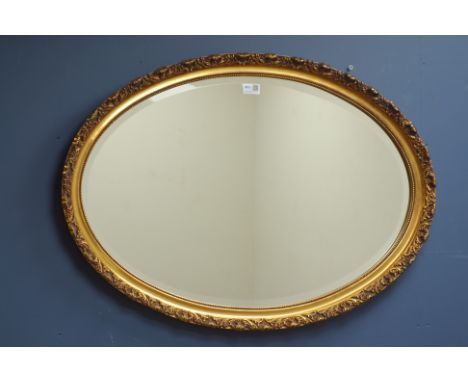 Oval gilt framed wall mirror, bevelled glass, 84cm x 59cm   Condition Report   Click here for further images, condition, auct