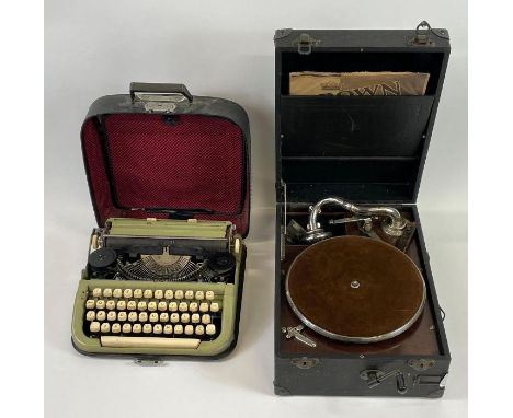 A vintage typewriter, along with a vintage record player 