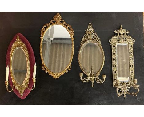 Four 20th century brass mounted wall mirrors, three with candlestick holders  