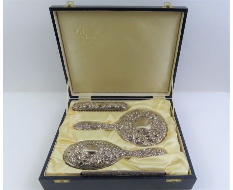 A cased silver dressing table set, consisting of a hairbrush, hand mirror, comb and clothes brush, Birmingham, 1994, W I Broa