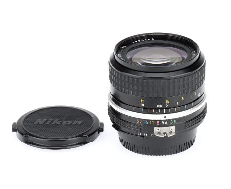 A Nikon Ai Nikkor f/3.5 28mm Lens, black, serial no. 1935665, body, VG, elements, VG, some light internal haze, complete with