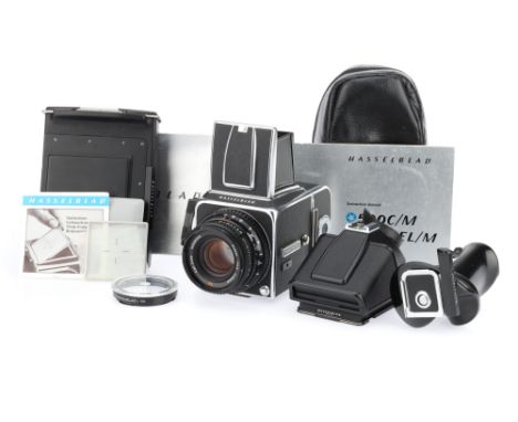 A Hasselblad 500C/M Medium Format SLR Camera chrome, 1980, serial no.RS1241652, with a Carl Zeiss Planar T* f/2.8 80mm lens, 