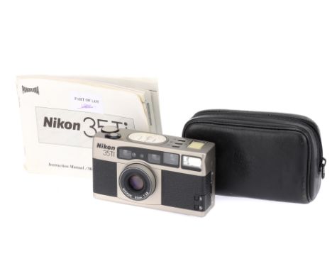 A NIkon 35Ti Compact 35mm Film Camera, serial no. US4013641, with Nikkor f/2.8 35mm lens, body, F-VG, powers up and appears t