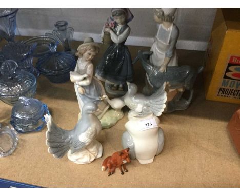Group of Lladro style figures together with a Beswick Fox