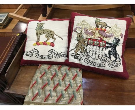 Two armorial tapestry cushions and one other