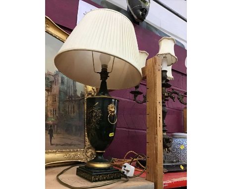 Classical style table lamp with guided floral decoration and lion head and ring handles