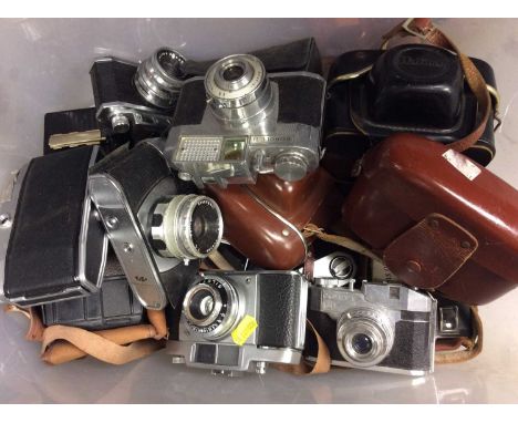 Group vintage cameras and brown leather ER suitcase