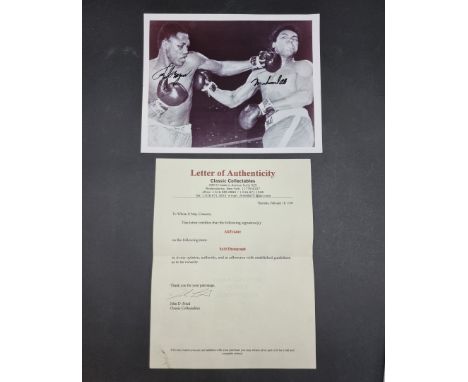 MUHAMMAD ALI/JOE FRAZIER:&nbsp;a photographic print of Ali and Frazier in the ring, signed by both in black marker, with COA 