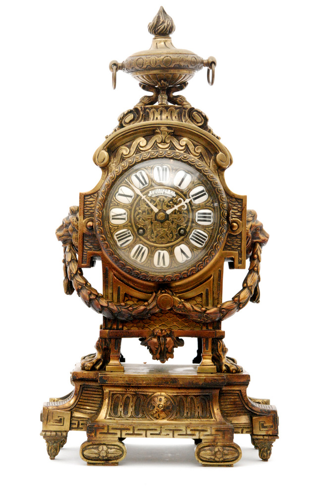 A late 19th to early 20th Century brass cased mantle clock, with eight ...