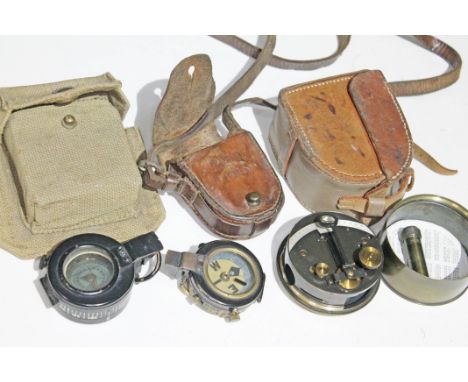 A group of three military compasses with cases.Condition: first and second world war, moving parts appear to function ok, no 