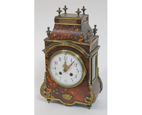 A French late 19th century Louis XIV style gilt metal mounted tortoiseshell mantel clock, the enamel dial diam. 11.5cm, doubl
