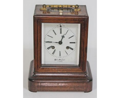 A French late 19th century marquetry inlaid rosewood mantel clock, gilt metal handle and bevelled glass panel to top, slide u