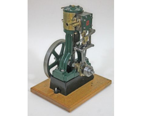A Stuart Turner model 5A live steam vertical engine, on mounted on wooden board, height 38cm. Condition - although used, appe