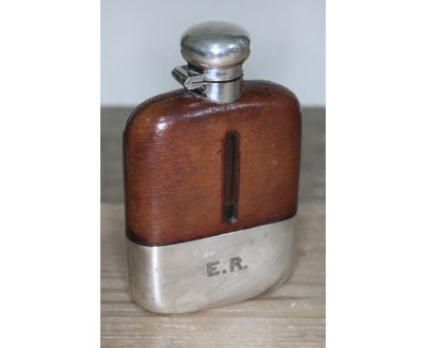 A silver plated and leather bound hip flask with bayonet fitting, makers stamp 'Despatch', Sheffield, height 14cm.  Condition