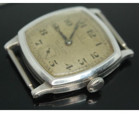 A 1920s Omega wristwatch in hallmarked silver case having double signed dial for retailer Samuel Lyon Junior, Blackpool, the 