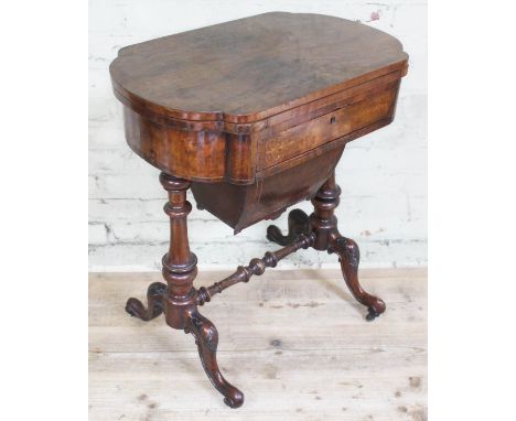 A Victorian walnut games table with fold over top revealing chess, backgammon and cribbage, height 78cm.Condition: old repair