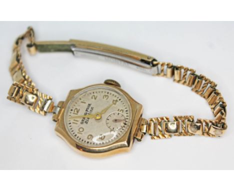 A hallmarked 9ct gold Grand Prix Election 15 jewel manual wind ladies wristwatch with rolled gold strap, gross weight (withou