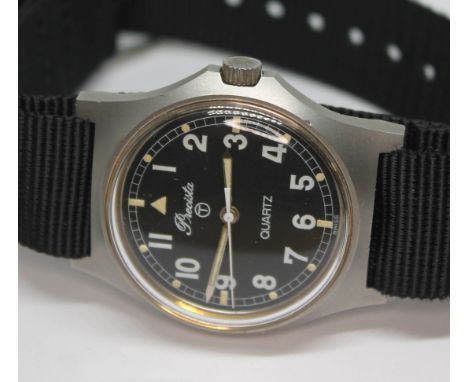 A 1980 Precista British Royal Navy issue stainless steel quartz wristwatch, the signed black dial having Arabic numerals in w