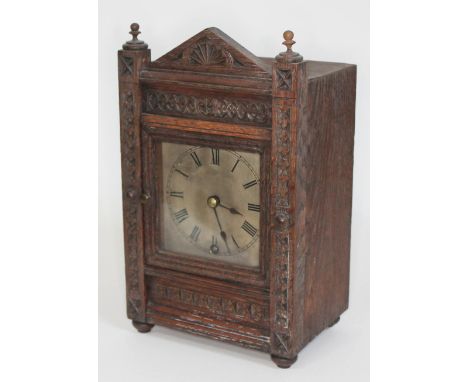 A German carved oak mantel clock by Winterhalder and Hofmeier, height 28cm.  