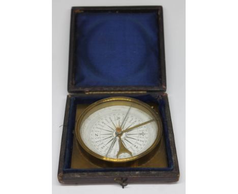 A brass compass, the 2 1/2" dial signed Casartelli Manchester, in leather case.