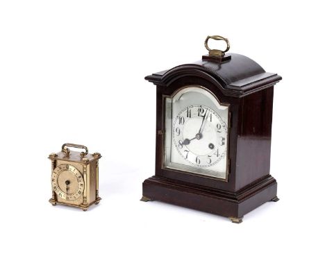 Junghans: a mahogany cased 8-day mantel clock, with silvered Arabic dial, fitted a two train 8-day movement, 32cms high; and 