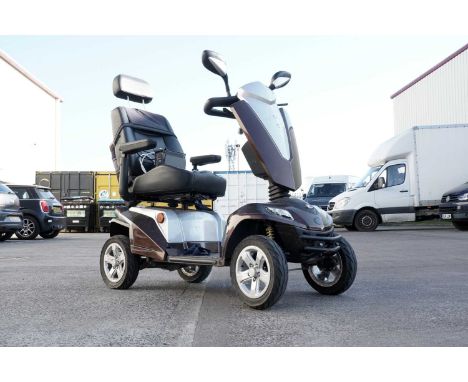 A Kymco KC ‘ForU’ electric mobility scooter, with key, charger and user’s manual.
