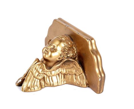 A 19th Century style gilt plaster wall bracket, with moulded top raised on carved putto base, 18cms high.