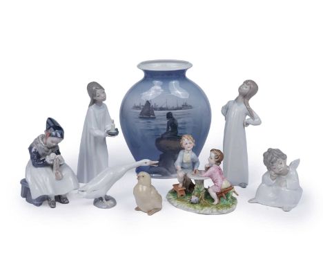 A collection of decorative ceramic figures, to include: Lladro figures of children, a goose and a cherub; a Nao chick; a Capo