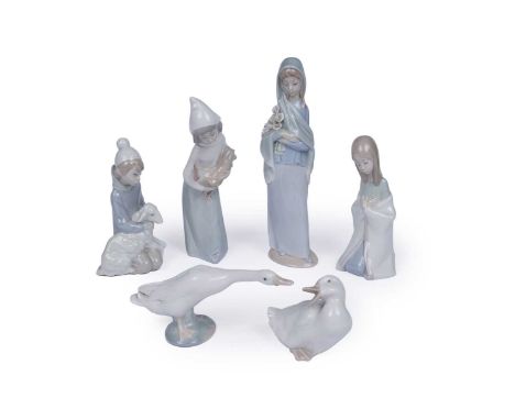 A selection of boxed Lladro and Nao ceramic figures, including: a Goose; a child holding a lamb, 16cms; a girl holding lilies