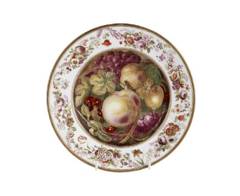 An early 19th Century plate, of Worcester type, hand-enamelled with a still life depicting fruit, within a floral garland bor