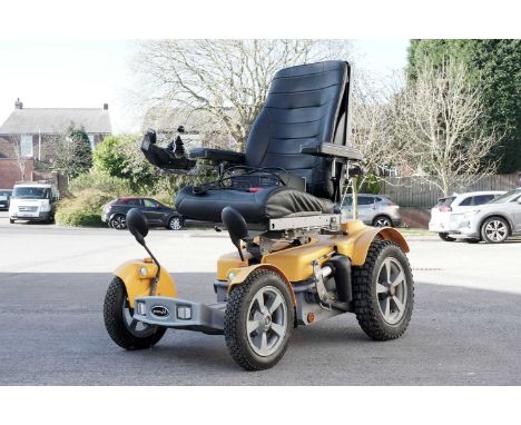 A Permobil Trax ESP electric powered wheelchair, with charger.