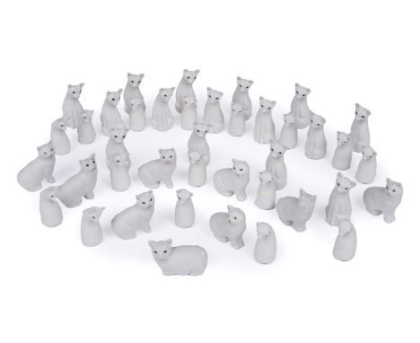Harper Shebeg Pottery, Isle of Man: a large collection of matte ceramic Manx cats, in seated and lying positions, the tallest