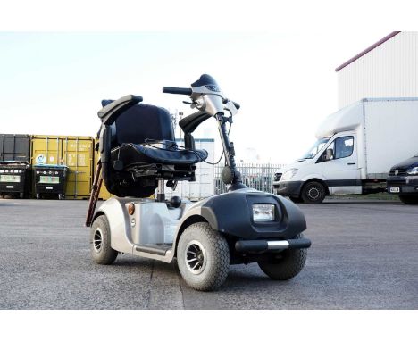 A Mercury Neo electric mobility scooter, with key and charger.