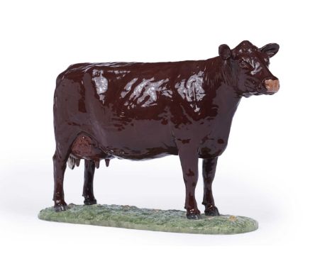 John Harper Shebeg Pottery, Isle of Man: a study of a cow, stood on naturalistic base, no.4/100, 29cms.