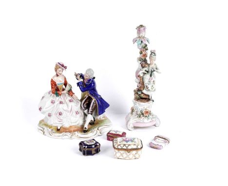 An early 20th Century Sitzendorf style figural lamp base, modelled as a lady with a bird, 37cms; and a similar Rococo style f