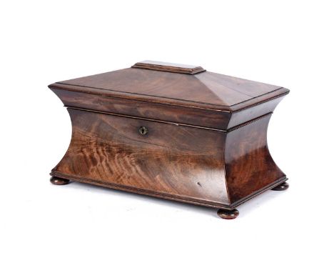 A Victorian sarcophagus shaped mahogany tea caddy, on bun feet, 36cms.