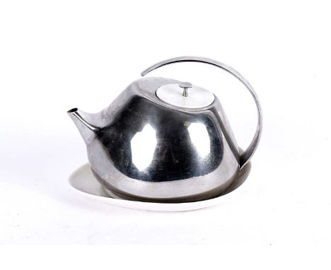 Helena Rohner for Georg Jensen: a Danish contemporary stainless steel and ceramic teapot, with curved handle, white ceramic l