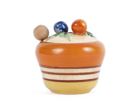 A Clarice Cliff ‘Bizarre’ preserve pot, with fruiting bough finial on black ground, banded with orange, yellow, and black, ma