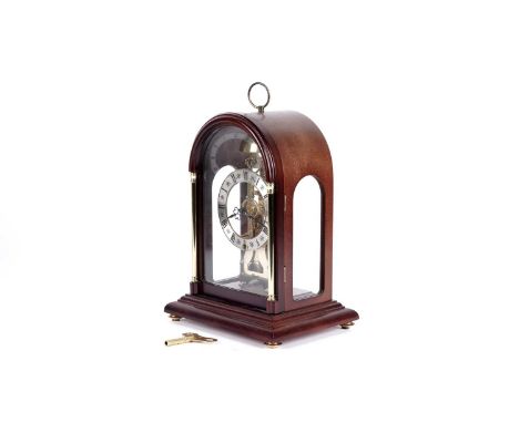 Hermle: a German skeletonised mahogany and brass 30-hour four glass mantel clock, with Roman silvered chapter ring, with Herm