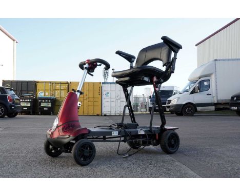 A Monarch Solax electric mobility scooter, with charger.
