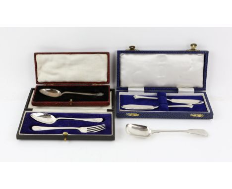 Silver two piece cased christening set comprising teaspoon and fork, a cased pair of silver butter knives, a cased silver tea