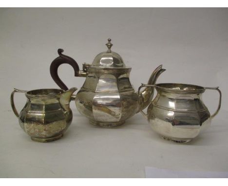 An early 20th century silver three piece tea set by Blankensee &amp; Son, Birmingham 1927, of octagonal bulbous form, compris