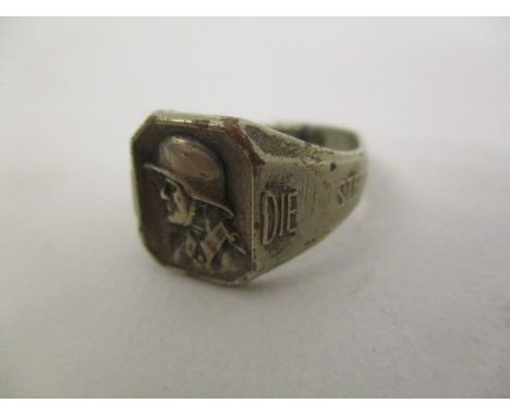 A WWII German metal ring decorated with a head and shoulder portrait of a German soldier, the shoulders inscribed Andenkenan 