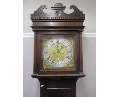 A George III long case clock, with an eight-day movement and later gong, a brass dial, silvered chapter ring, subsidiary seco